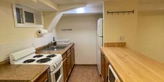 Charming 1928 Row Home for Rent with Modern Amenities — 3 Bedroom 2 Full Bath w/ 2 Half Baths, 2 Kitchens, located in Kingman Park, Near DC Armory & Eastern Market Gallery 49