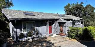 Three bedroom, two bathroom home with gorgeous views and sunroom for rent in the hills of Fairfax! Gallery 1