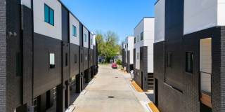 Discover modern elegance in the newly constructed Edgewater Condominiums, a boutique community featuring 18 luxurious units with 9 still available for purchase. Gallery 7