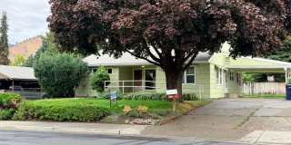 4 bed/1.5 bath in CASHMERE! Large yard, two living spaces, extra room & storage! Spacious living! Gallery 1