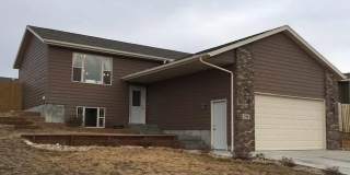 Spacious 4-Bed, 3-Bath Family Home with Fenced Yard and Attached Garage Gallery 1