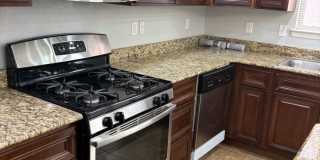Charming home located in a gated community with access to a community pool. Gallery 6
