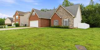 Charming Brick Home with Open Layout & Spacious Backyard in Pleasant View Gallery 1