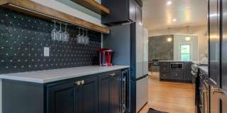 Completely remodeled like new Gingerbread midtown cottage with gleaming hardwoods, converted from a 3/1 to a 3/2. Gallery 18