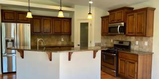Live In Luxury with Vaulted Ceilings, Granite Countertops, and a Gas Fireplace! Gallery 3