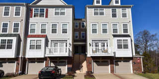 Bright and stylish four level garage townhouse nestled in a peaceful neighborhood setting. Gallery 1
