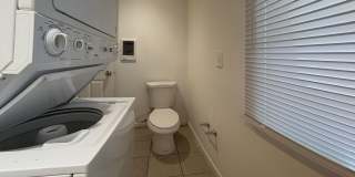 Charming 4BR/2BA Rowhouse with Hardwood-Style Flooring Throughout Gallery 1