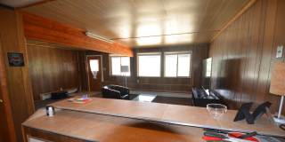 Garden level one bedroom apartment in the hills above BRECK.  Pets OK!  Includes HEAT and electric!  One Car Space in the Garage! Gallery 1