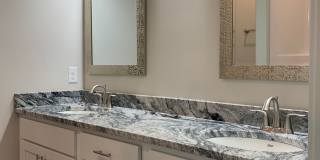 Zero entry ranch townhome with 2 stall garage. Spacious 2 bedrooms with walk in closets, 2.5 bathroom, 1st floor laundry Gallery 1