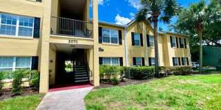 MOVE IN NOW!! Gated community Miriada! 1st floor 1X1.5 bath condo near pool area!!! Laminate wood flooring in living area and carpet in bedroom! Has washer & dryer! Gas stove & water heater! Gallery 3