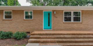 Discover the epitome of stylish living in this meticulously updated mid-century brick ranch, now available for rent. Gallery 1