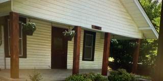 Charming 2 bed 2 bath 1 car garage AND 2 CAR CARPORT!!  Modern Farmhouse with Glassed in Sunroom! Gallery 1