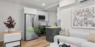 Rare Renovated 3BR/2BA Townhouse with Private Yard & NYC Views Gallery 1