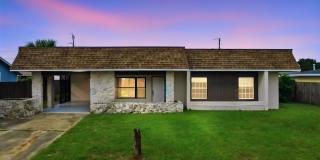 Freshly Painted 3-Bedroom, 2-Bathroom Home with Spacious Kitchen, Fenced Yard & Carport Gallery 1