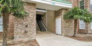 Don't miss this 4-bed, 3-bath condo TWO miles from the ocean! Gallery 1