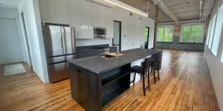 Historic Charm, Modern Luxury,  2 bedroom condo at Greylock Works! Gallery 1