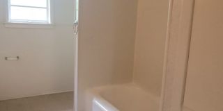 Huge 3 bedroom/1 bath upstairs apartment with Water, Gas Range and Refrigerator! Gallery 11