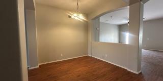 Single-level 3-bedroom home in a desirable Chandler location featuring a 2-car garage and tile roof and wood plank flooring throughout Gallery 10