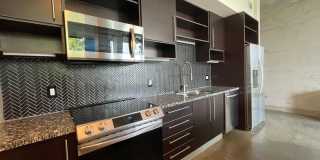 Awesome 1BR Loft Style Condo Overlooking Midtown! Gallery 1