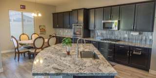 Gorgeous 4 Bed + den Single Level Home in gated community in North Peoria with RV Gate / BBQ!! Gallery 3