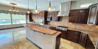 Elegant Desert Retreat – 3+ Bedroom Home with Pool in Mountain’s Edge Gallery 1