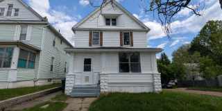 Spacious 5-bedroom, 1-bath home offers flexible living across multiple levels in Akron Gallery 1