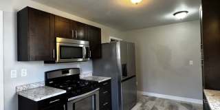 Available NW, Classic Charm, Updated Kitchen & a Fenced Backyard and 1-Car Attached Garage Gallery 1