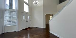 Grand 5 Bedroom Home Featuring 19ft Ceilings, Family Room & Main-Level Suite Gallery 9