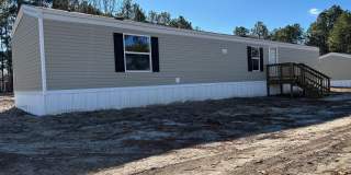 Brand new 3 bed, 2 bath single wide mobile home located in Eagle Springs! Gallery 1