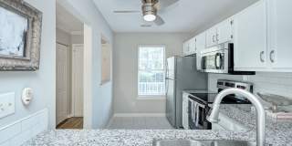 Discover this beautifully updated Raintree townhome featuring an open floor plan and a range of contemporary enhancements. Gallery 6