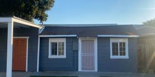 Beautifully maintained detached house with A/C, parking, refrigerator, washer and dryer, private rear yard, CAT friendly Gallery 1