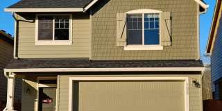 Beautiful Craftsman Style Home! 2 Car Garage! Gas Fireplace and Granite Counter Tops! Attached Garage, Private Yard, and Convenient Access to Shopping, Parks & I-5 Gallery 1