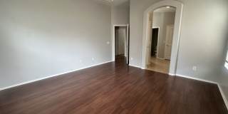 Single-level 3-bedroom home in a desirable Chandler location featuring a 2-car garage and tile roof and wood plank flooring throughout Gallery 23