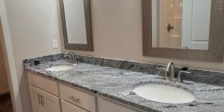 Ranch townhome with 2 stall garage. Spacious 2 bedrooms with walk in closets, 2.5 bathroom, 1st floor laundry Gallery 14