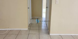 Beautiful 2/2/1 1150 Sq. Ft. with BONUS ROOM!!... tile & luxury plank flooring, Frest paint and a large fenced in yard! Gallery 10