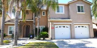 Move-In Special! Deposit Moves You In! Beautiful 5-Bedroom Home with Fireplace & Garage in Delano Gallery 1