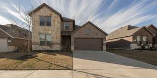 North-facing home featuring a large covered L-shaped patio and garage with Polyspartic scratch-resistant paint, a versatile under-stair closet, a modern kitchen, and elegantly designed bathrooms. Gallery 1