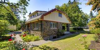 Historic 4-Bedroom Stone Home with Timeless Character, Hardwood Floors, Spacious Living & a Large Private Yard Gallery 1