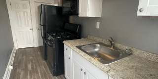 2 Bedroom + Den Home with Porch, Fenced Yard, and Water Included on Barclay Street Gallery 5