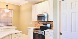 Experience Bell Tower Park. GATED ground floor 2 Bed 2 Bath Den 1 Car Garage Condo. Gallery 17
