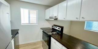 Spacious 2-Bedroom Apartment for Rent in Millwood Spokane Valley - Updated Unit with A/C, Stainless Appliances, and Covered Parking at 8929 E Liberty Ave Gallery 1