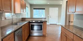Spacious 2 bed/1 bath home! Fenced yard, a/c, d/w, w/d, large garage and MORE!! Gallery 11