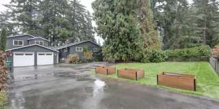 Mercer Island: 5-Bed, 4-Bath Home with Water Views, Large Yard, Updated Kitchen, Private Primary Suite Gallery 1