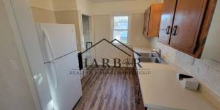 3BR Home in Austin - Enclosed Front Porch, Detached Garage & Basement Laundry Gallery 1