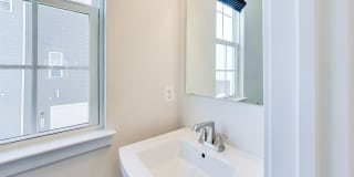 Welcome to this beautifully designed 3 level townhome in Westphalia Town Center Community! Gallery 11