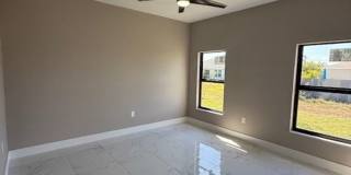 Brand-New Luxury Home with 3-Car Garage & Lawn Care Included | Modern Living in Cape Coral! Gallery 17