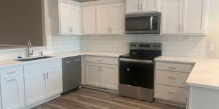 Walkout ranch townhome with 2 stall garage. Spacious 2 bedrooms with walk in closets, 2.5 bathroom, 1st floor laundry Gallery 1