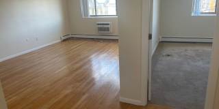 No Fee Massive 2 bed with New floors, kitchen and paint, AC VERY SUNNY!!  PARKING INCLUDED Gallery 1