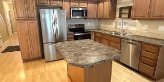 Great Location!  Well maintained Townhome , one car garage, fenced backyard! Gallery 4