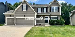 Beautiful Four-Bedroom Home with Three Car Garage, Wood Floors, Finished Basement and a Fenced Yard!! Gallery 1